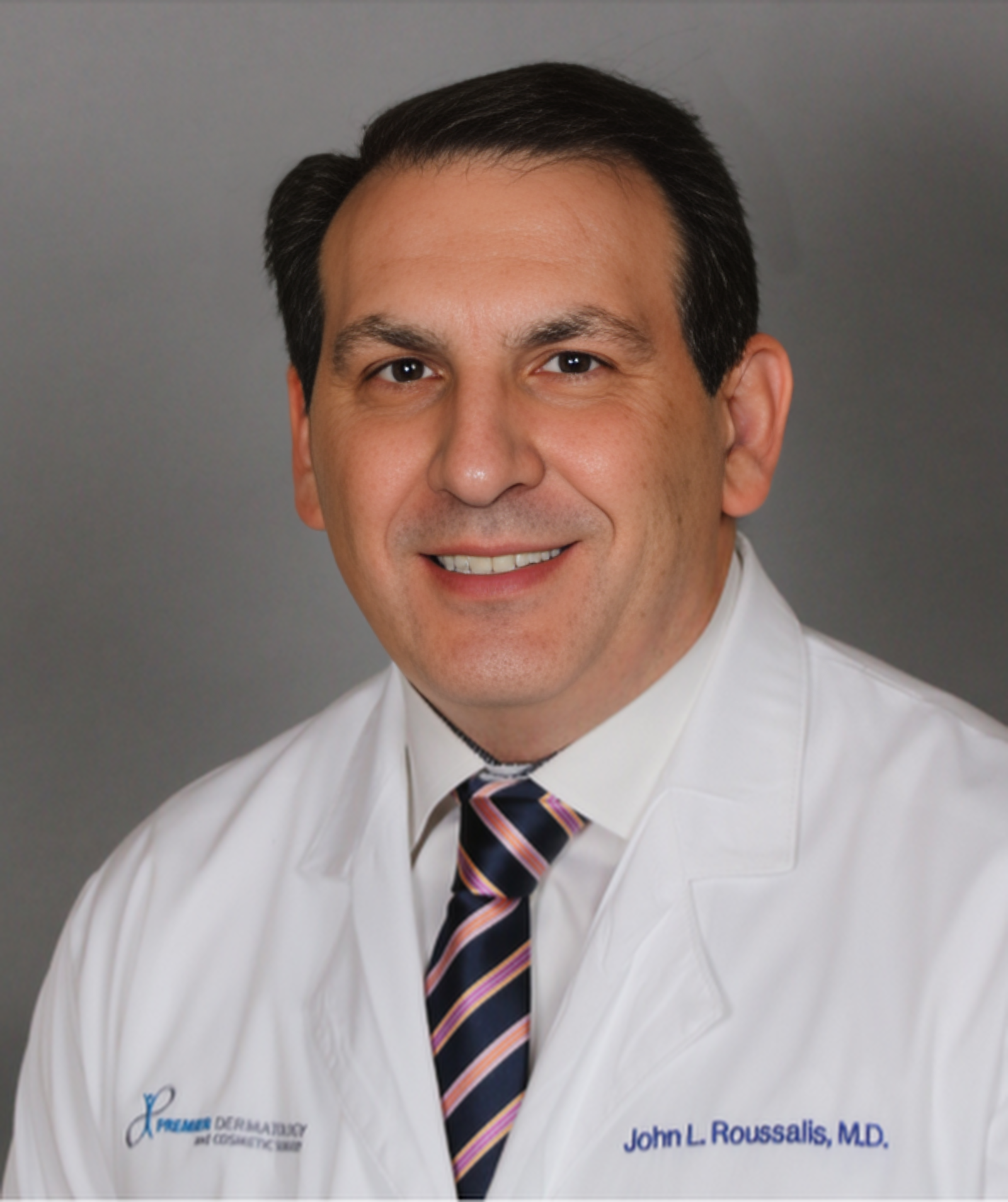 Dr. John L. Roussalis,