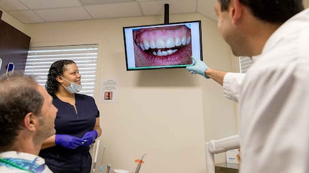 Instagram post by Dr. Andrew Ferrier, DDS: There is no one better to help you understand and acquire your perfect smile with dental implants!