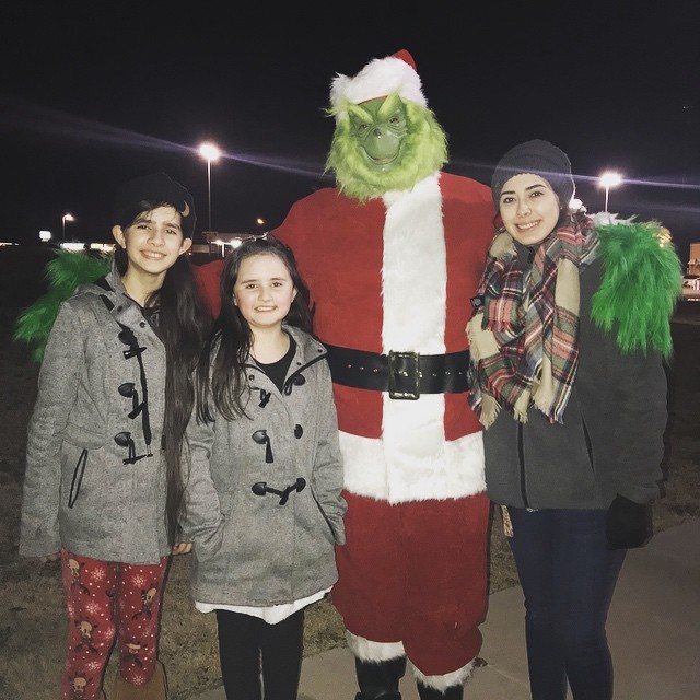Instagram post by Dr. Andy Hand: Me and my girls tonight...just my ‘usual Monday attire!’ 😂#itscoldoutside #grinchlife #drandyhand #bodybyhand