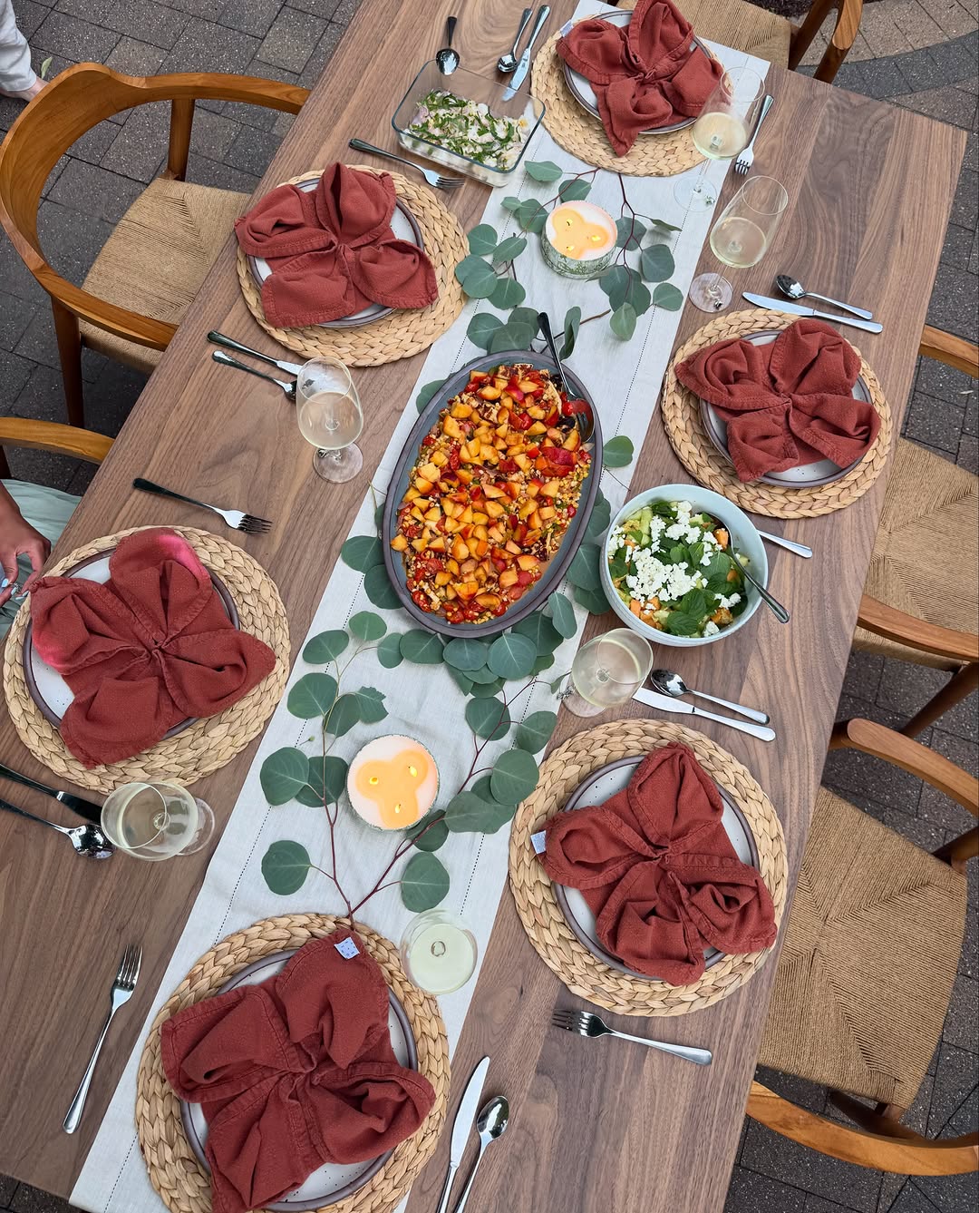 Instagram post by Dr. Anna Bakeman: leaning into these steamy summer nights with outdoor dinners and lots of citronella