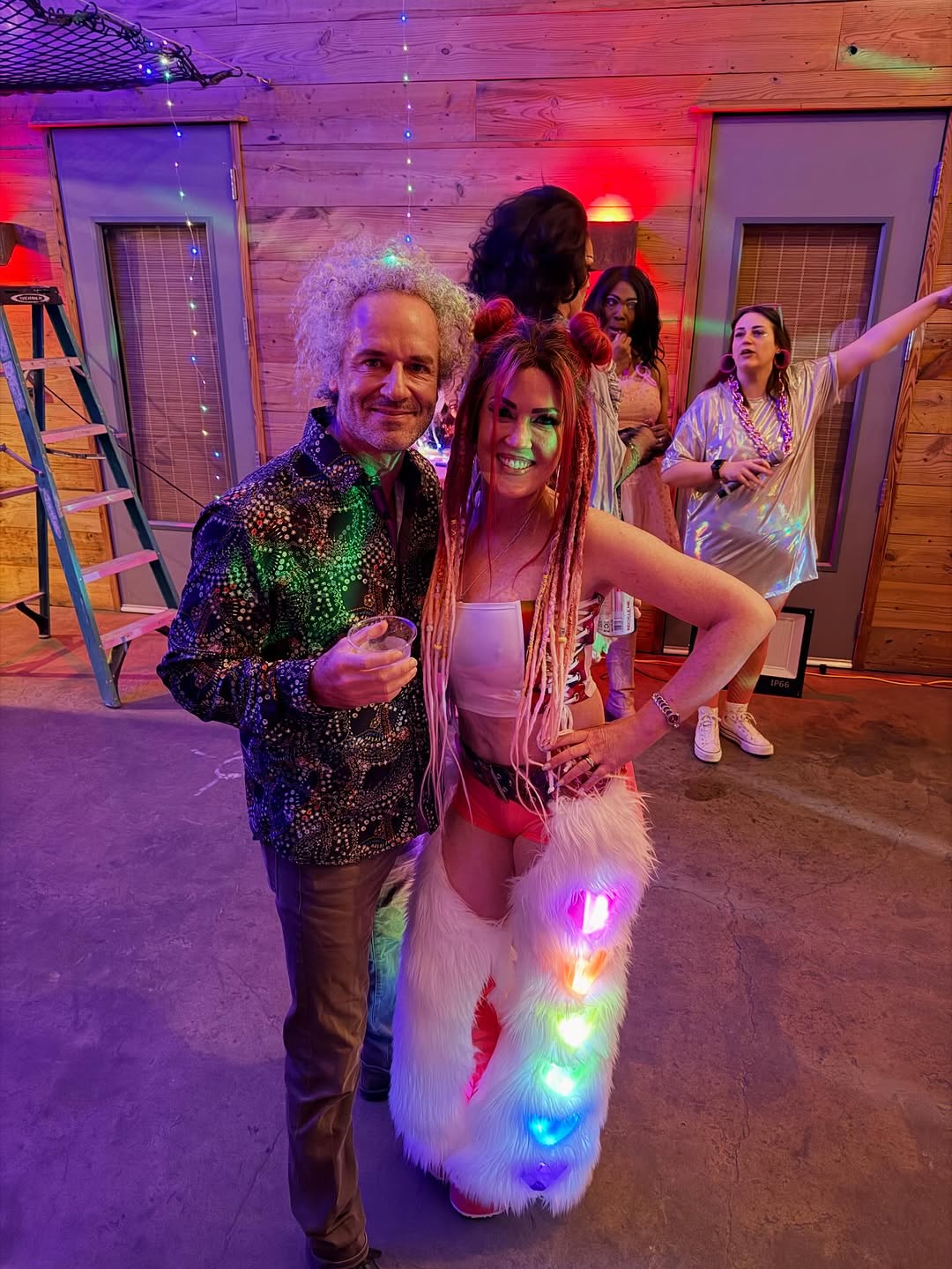Instagram post by Dr. Ashley DeLeon: Just your typical office holiday party! 🥳🤣🙌🏻 Electric Nights and Holiday Lights at @cranects. 🩷🩵🤍🩵🩷