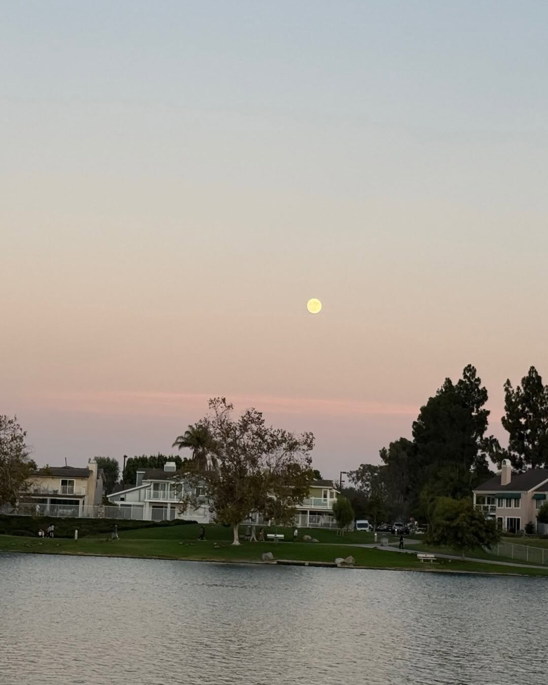 Instagram post by Dr. B. Kalantarian: Soft skies, quiet waters, and a full moon to guide the way. 🌅