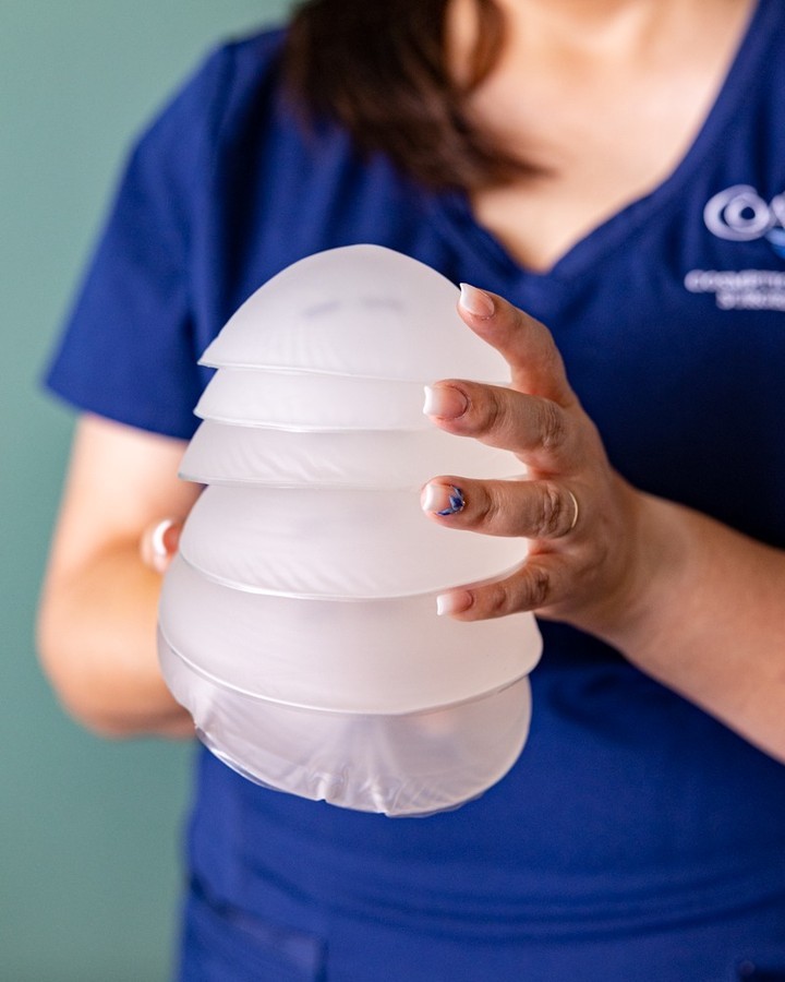 Instagram post by Dr. Cassidy Hinojosa: Do you need implant revision surgery? 👀 If you are experiencing any of the following issues with your breast implants, it may be time to co…