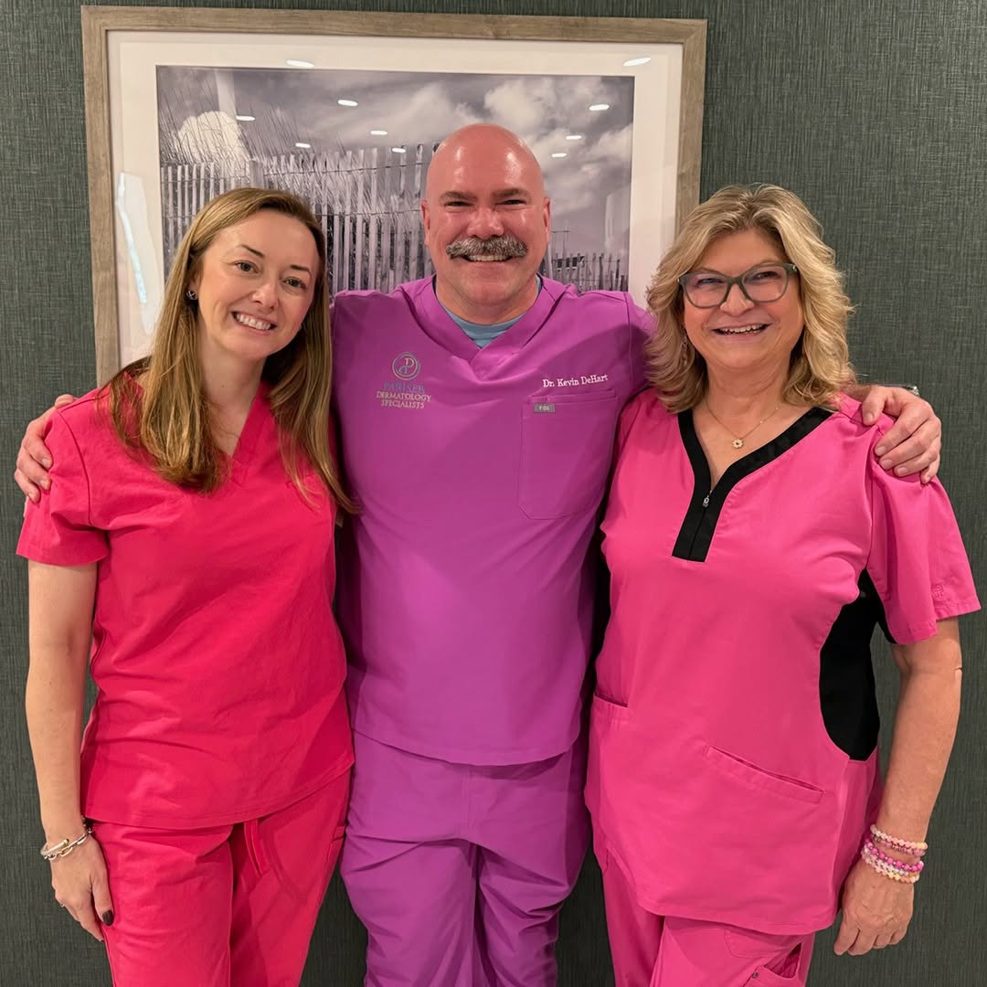 Instagram post by Dr. David M. Pariser: 🌸Pink Power in Suffolk!💖 Dr. Oldfield, Dr. Kevin DeHart, and Jodie Neal brought a pop of pink to the office last week. From vibrant fuchsi…