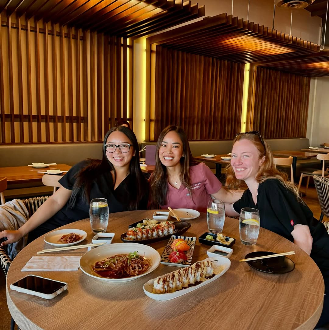 Instagram post by Dr. Donna Tran: Lunch date with my two main medical assistants 🥳 so grateful for them! They help me see patients — do skin checks, treat skin cancers, rash…