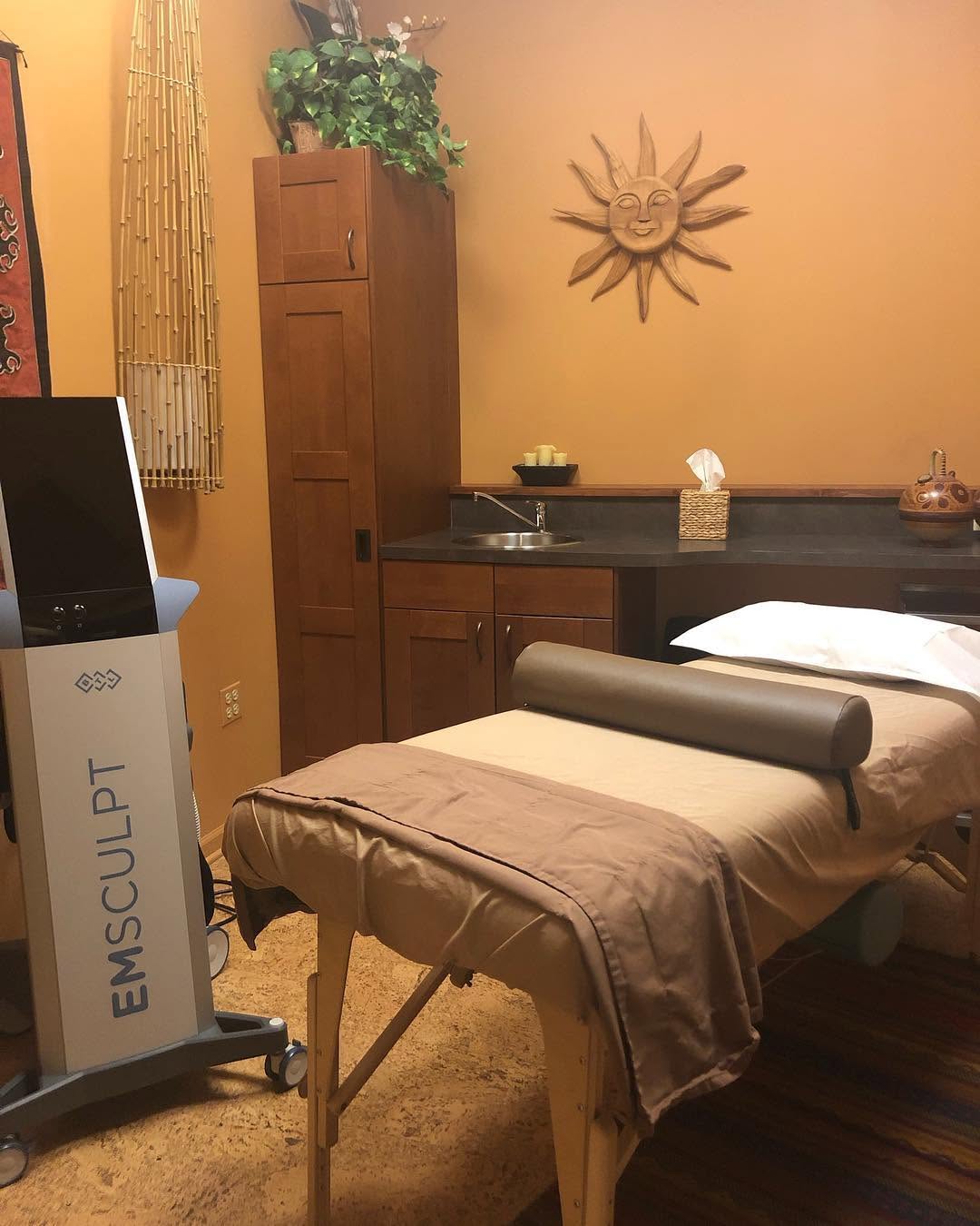 Instagram post by Dr. Elysa Fisher: Our new sleek Emsculpt unit provides a non painful means to add and define muscle while decreasing fat.