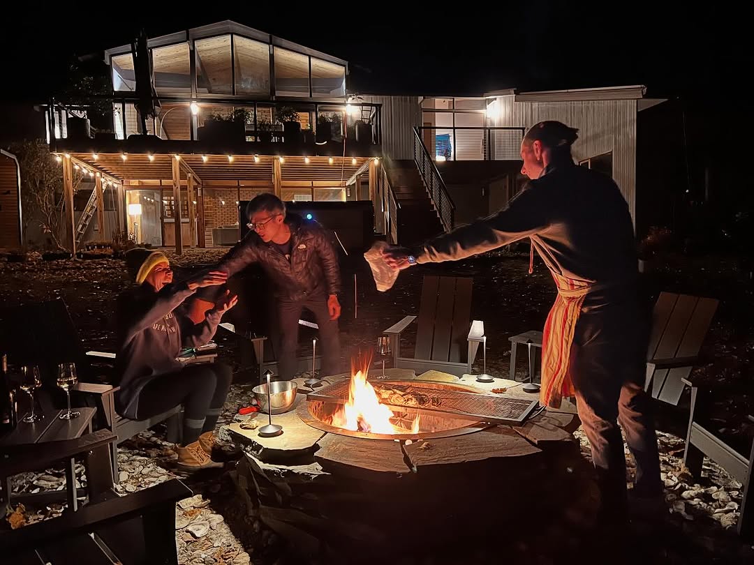 Instagram post by Dr. Emile Brown: Another great night of good food and even better company. I am super happy with how the dry-stacked stone, smokeless firepit we built turned…