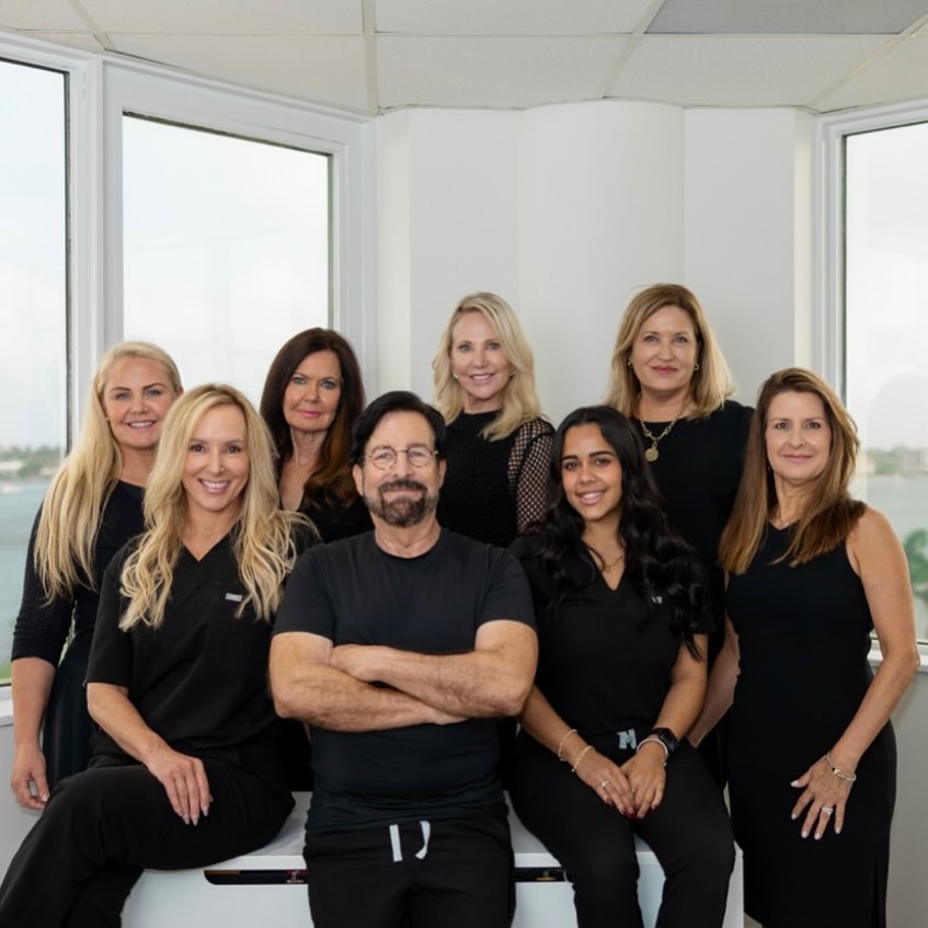 Instagram post by Dr. Fredric M. Barr: Dedicated to enhancing beauty and confidence, one patient at a time. Meet the team that makes it all possible! #palmbeach #facelift #explant…