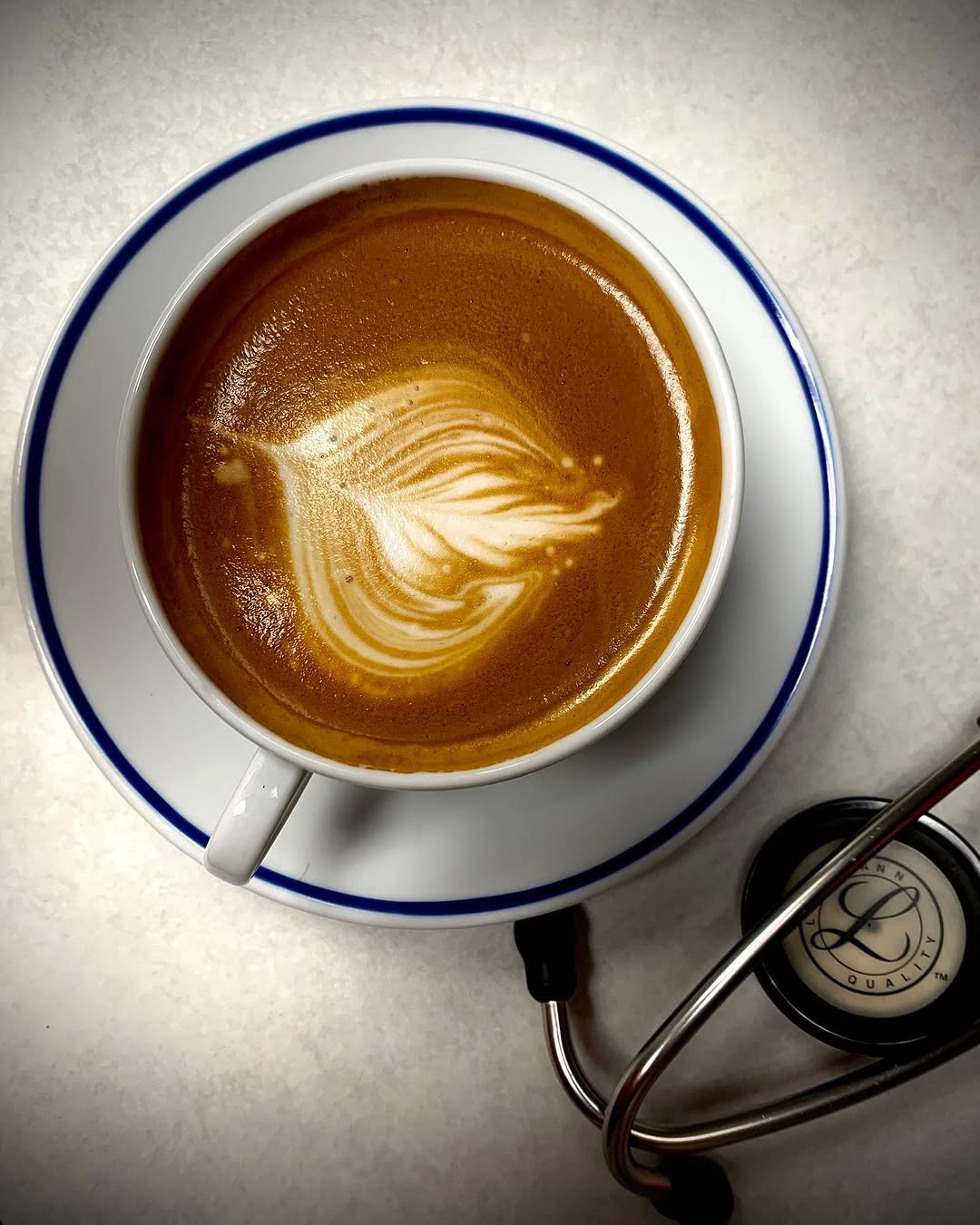 Instagram post by Dr. George Branning: Over the hump. A little early afternoon java boost. #latteporn #coffeebreak☕️ #caffeineismedicine #doctorjava