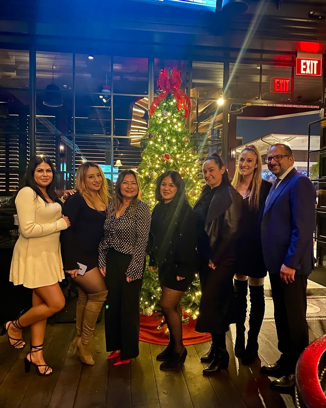 Instagram post by Dr. H. Joseph Naim: Spreading cheers, good vibes, and holiday magic! Happy Holidays from me and my staff 🎅🎄 #OfficeHolidayParty #HolidayVibes #HoHoHo