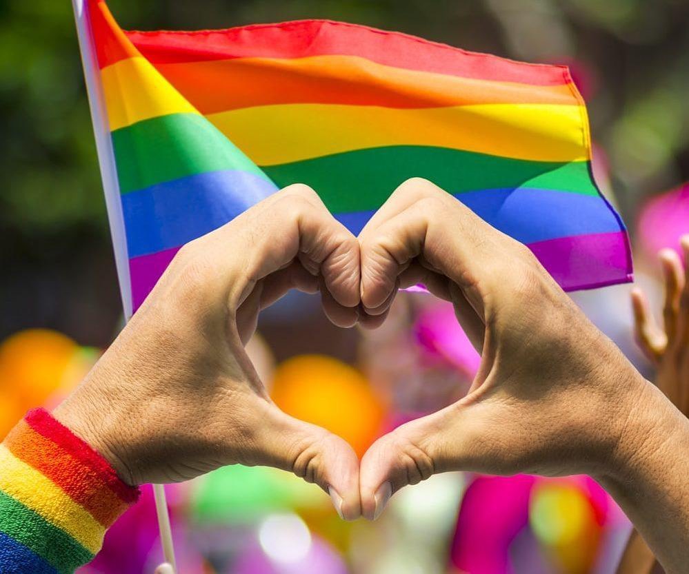 Instagram post by Dr. Haydee Docasar: Happy Pride Month! Love has no gender 💙❤️💛💚 #pridemonth #beyourself #lgbtq🌈 #transgender #gay #nonbinary
