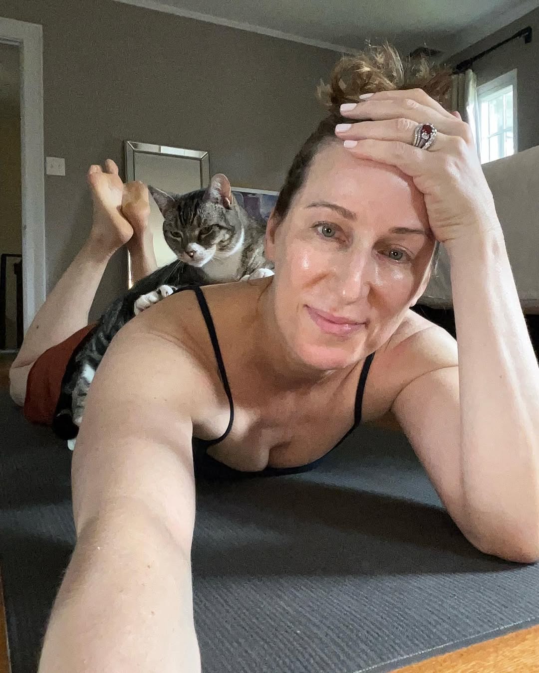 Instagram post by Dr. Holly Happe, DO: Sometimes power planking with @melissawoodhealth doesn’t go quite as planned… or maybe the 🐈⬛ thought I needed a few extra pounds added? R…