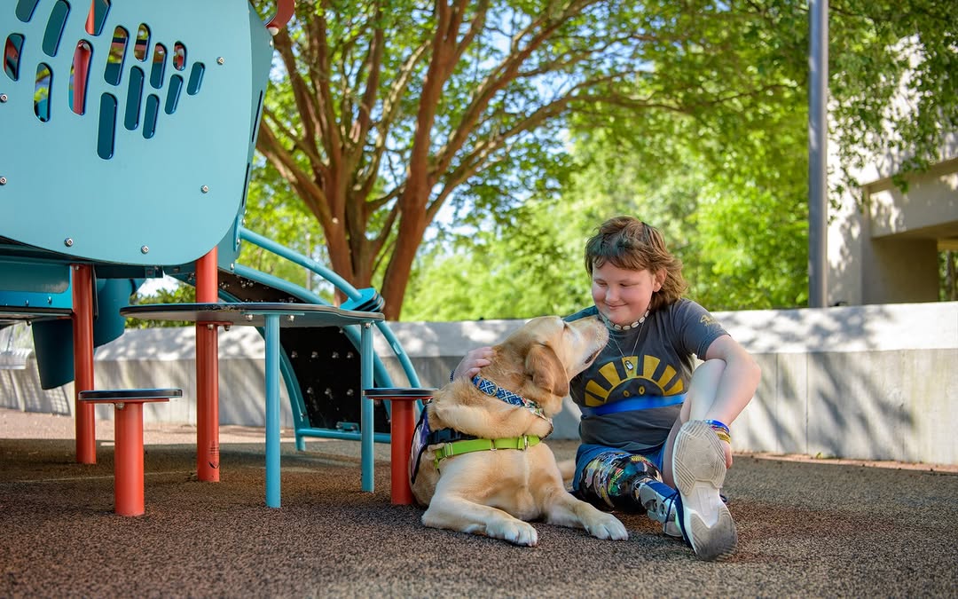 Instagram post by Dr. Jeremiah Miller: Across our hospitals in the Midlands and Upstate, our animal-assisted therapy programs bring specially trained facility dogs and volunteer p…