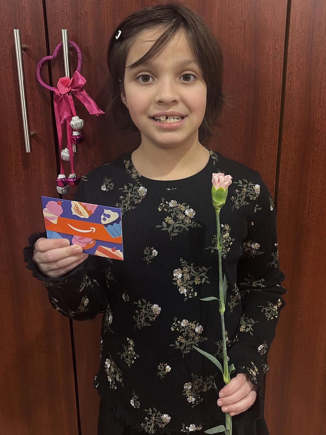 Instagram post by Dr. Jill Varriale, D: Congratulations! 🎊🎈 to our New Year's raffle winner Lorelai! Hope you enjoy your gift card 🫶🏼🫶🏼 #astoriafamilyorthodontics #astoriabra…