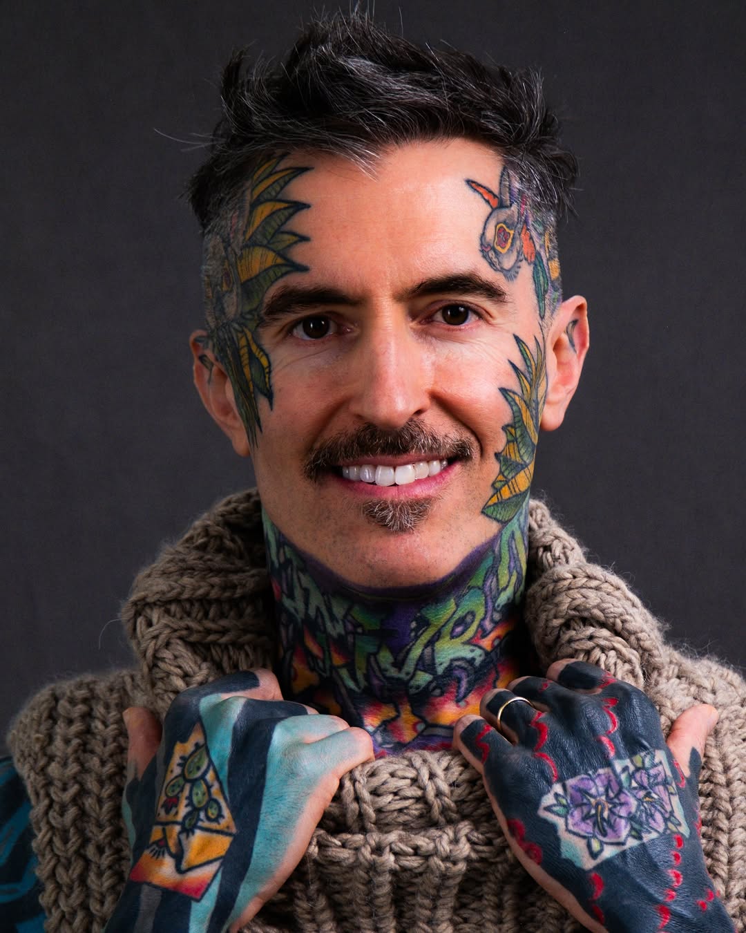 Instagram post by Dr. John Brosious: Facial skin customization . . . 2nd pass on face tattoos complete✅. Added more black and extra color for contrast. 3rd pass on purple neck b…