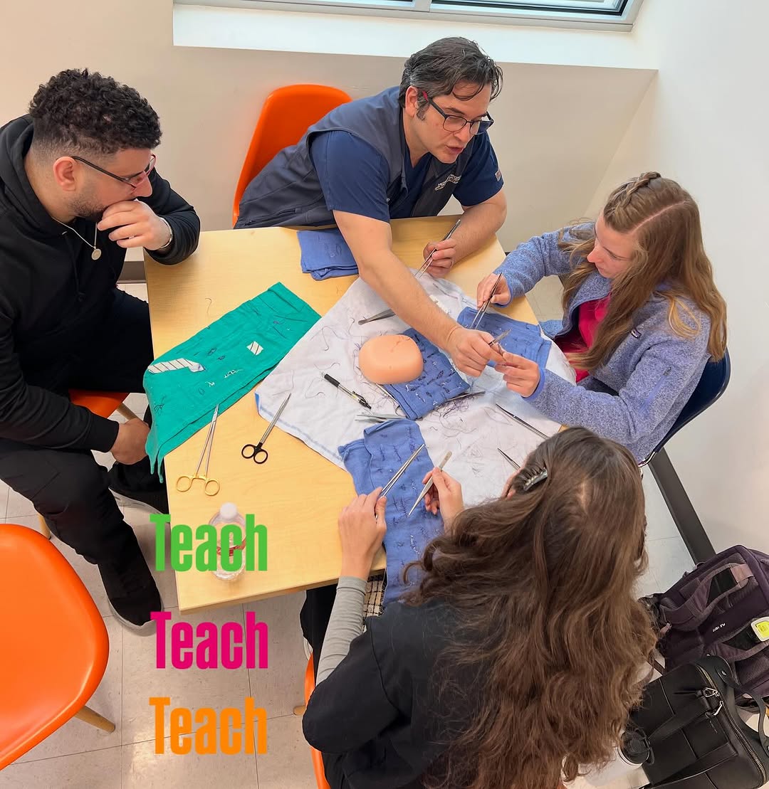 Instagram post by Dr. John Pilcher: Dr. Allen Alvarez shows his commitment to teaching by helping UIW students learn how to suture 😷 #drallenalvarez #teach #giveback #uiw #med…