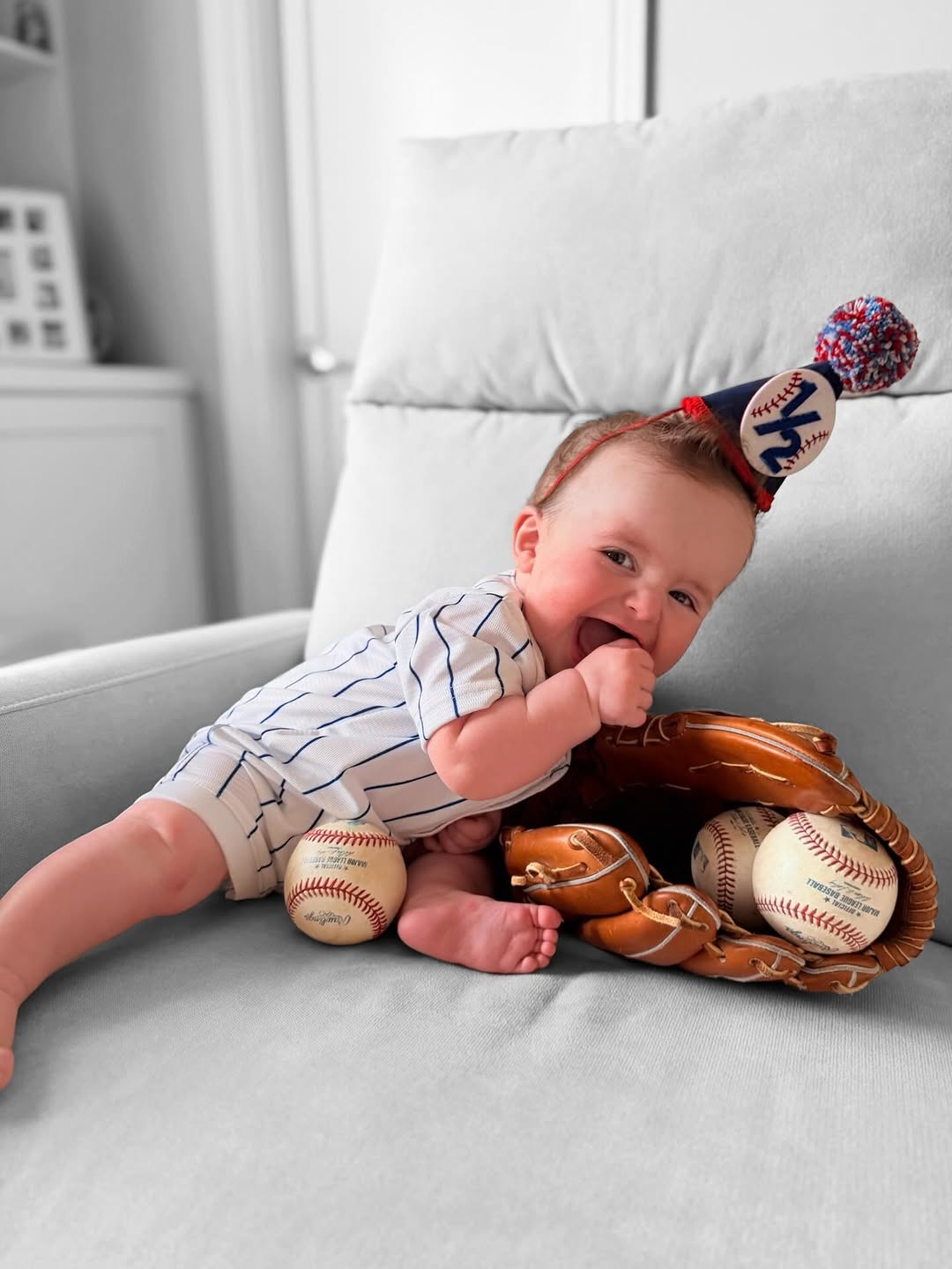 Instagram post by Dr. Jonathan C. Weinrach: Our little MVP turned 6 months old ⚾️💙 #weinrachplasticsurgery #baseball #halfbirthday #littleMVP #baseballbaby