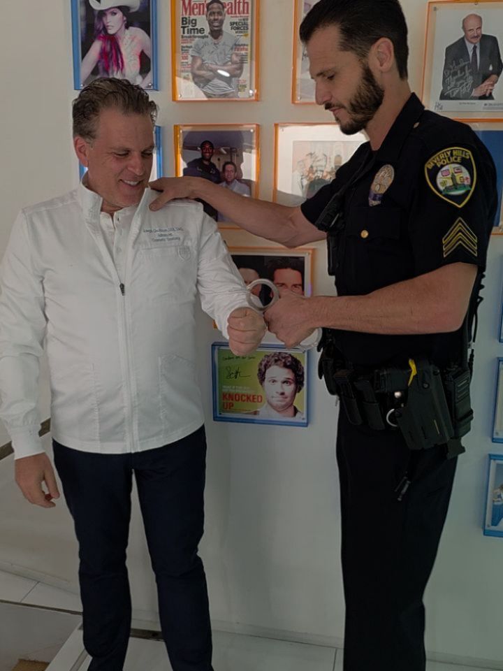 Instagram post by Dr. Joseph Goodman, DDS, D: Getting arrested for being too good 🦷🚔 #chooseyourdentistwisely #beverlyhillsdentist #cosmeticdentist #lapd
