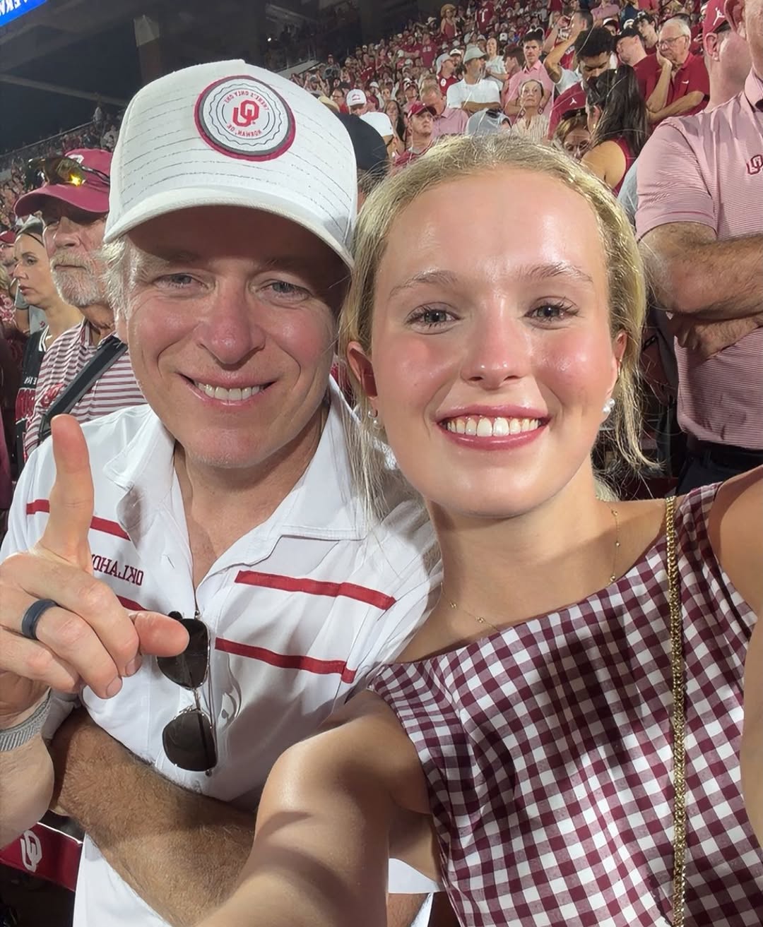 Instagram post by Dr. Justin M. Jones: First game of freshman year and my girl still comes and sits with me !! 🥺🥰. Boomer !!