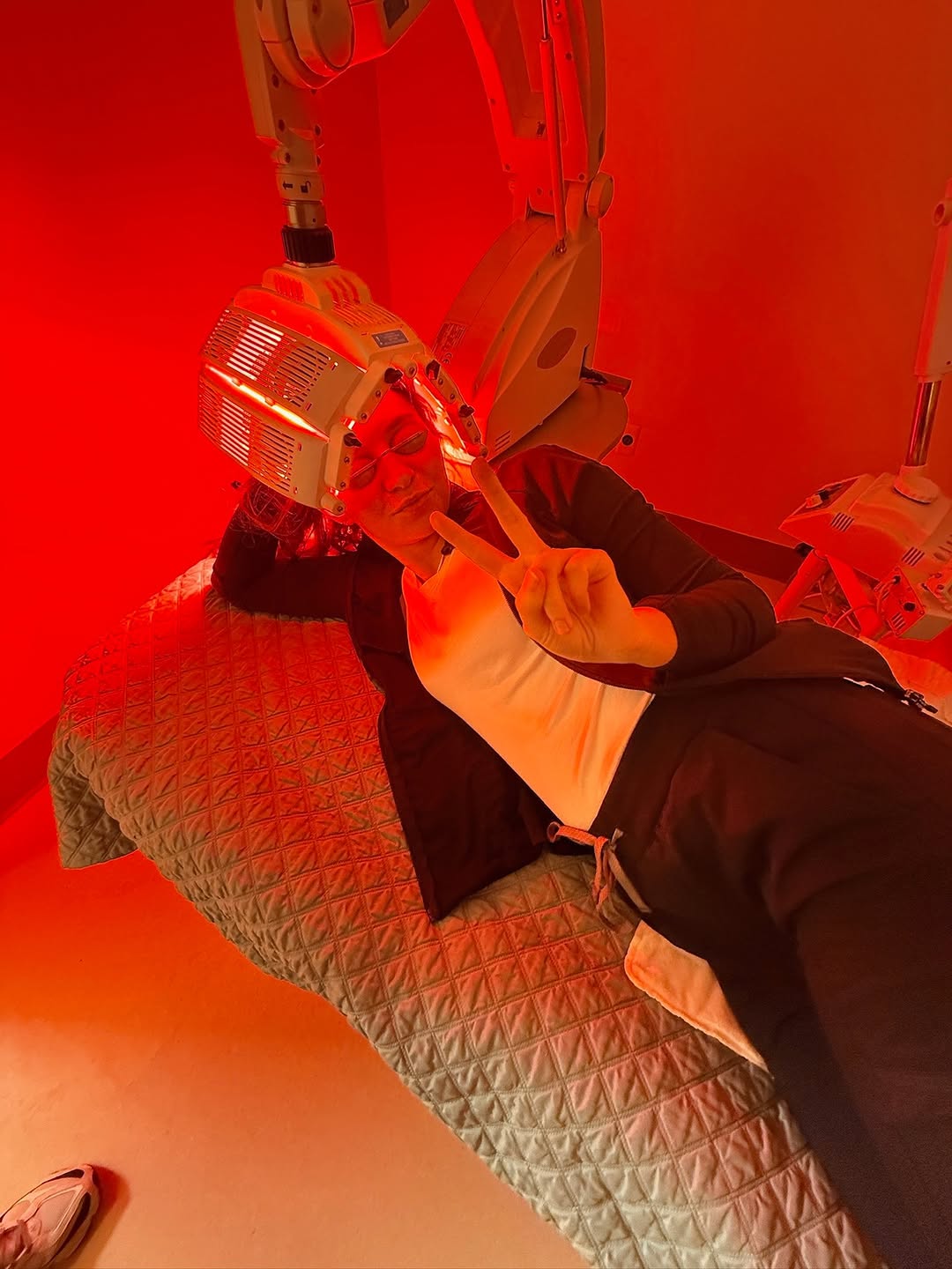 Instagram post by Dr. Katherine L. Caretti: Out of office. In our office. ✌️ Taking a little time for your skin? We support it. Red light therapy can help reduce redness, improve textu…
