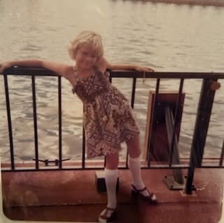 Instagram post by Dr. Kelly Cobb: It’s Friday Flashback! 👶💕 Recognize this sweet face? Here’s your clue: She’s been caring for patients for decades, believes wellness start…