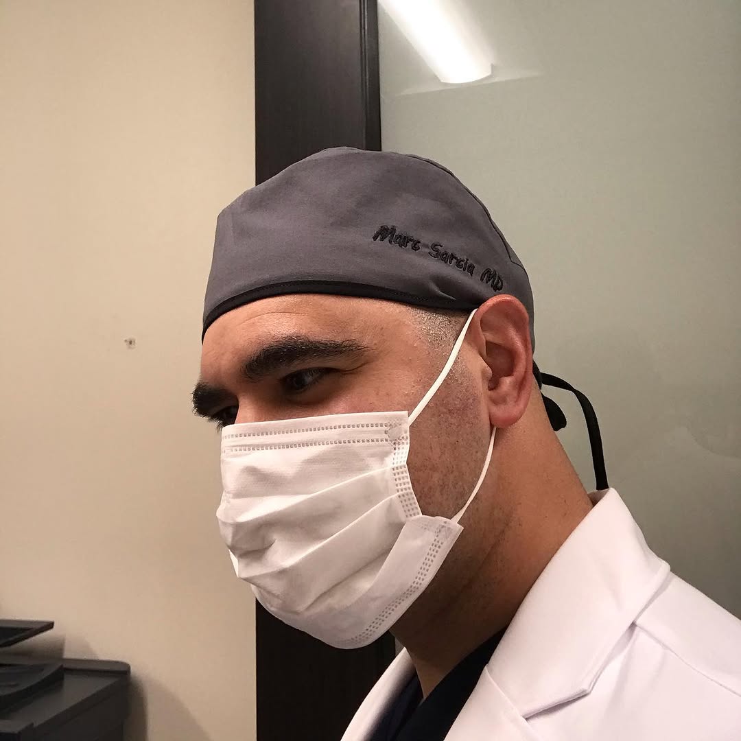 Instagram post by Dr. Marc A. Sarcia: Thanks Mom! Beautiful scrub caps for work.👨⚕️😊