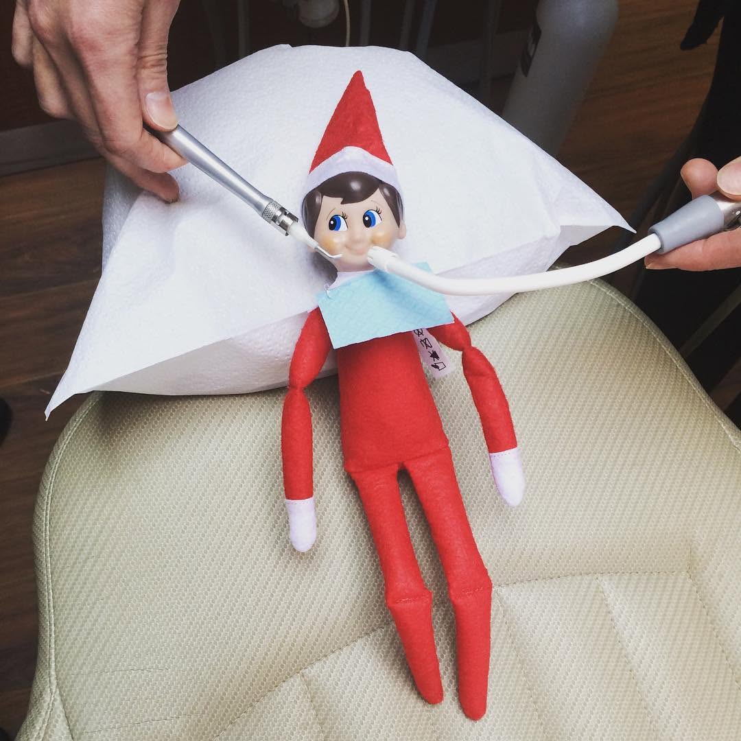 Instagram post by Dr. Mark DiRe, DDS: Meet Kringle, our newest patient. Today was his first dental visit! Have you scheduled yours? #elfontheshelf #nocavityclub