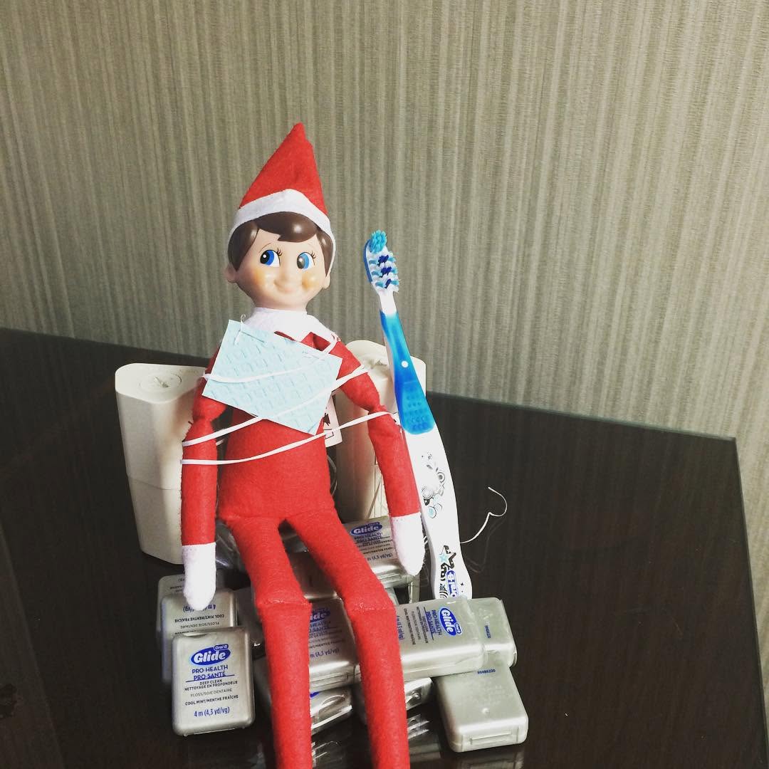 Instagram post by Dr. Mark DiRe, DDS: Kringle was causing mischief in the floss today! #dental #flossthosepearlywhites #elfontheshelf #nocavityclub