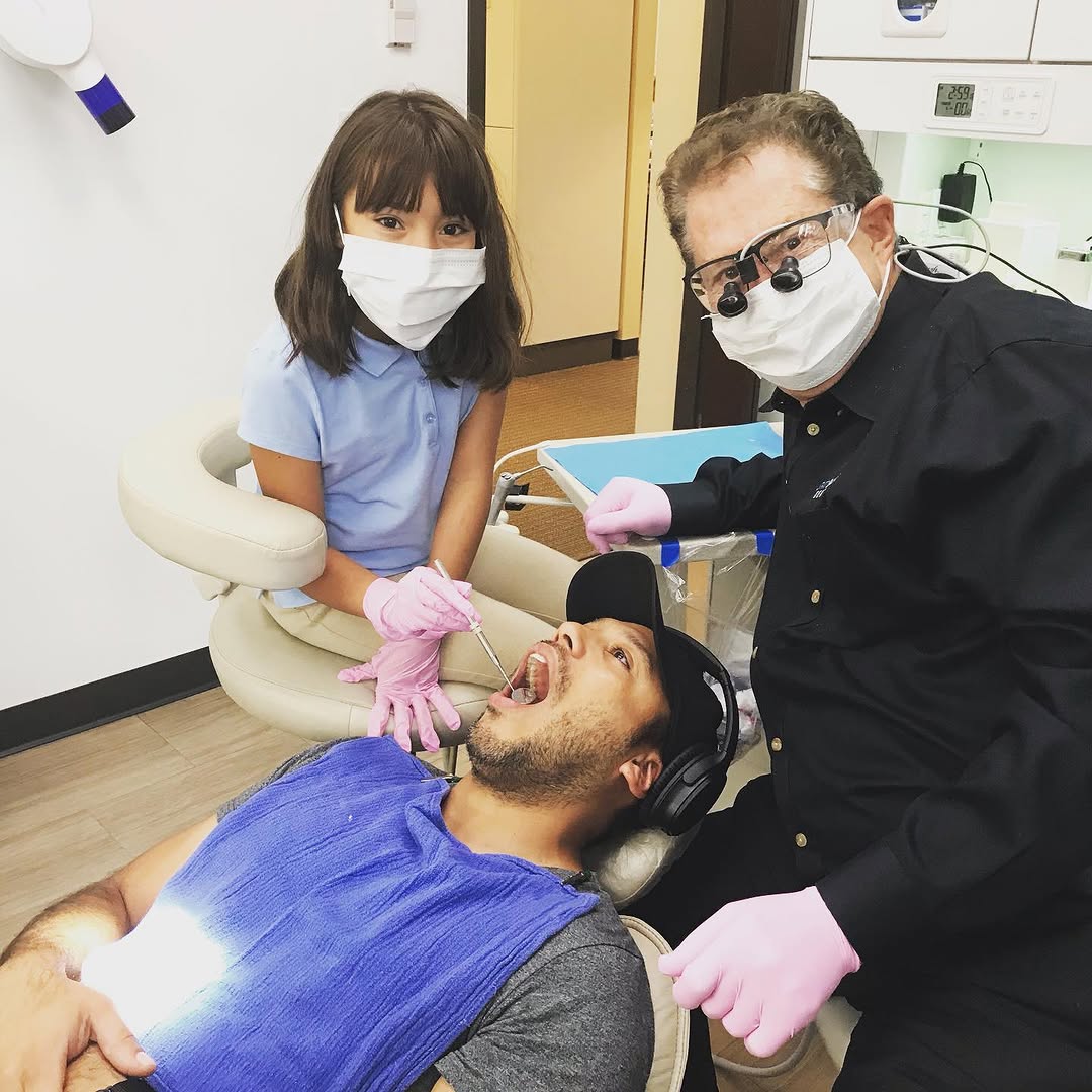 Instagram post by Dr. Mark Sayeg, DDS: Vanessa’s daughter wants to be a dentist when she grows up!#takeyourdaughtertowork #trainingthemyoung #dentistsandy springs #dentistatlanta …