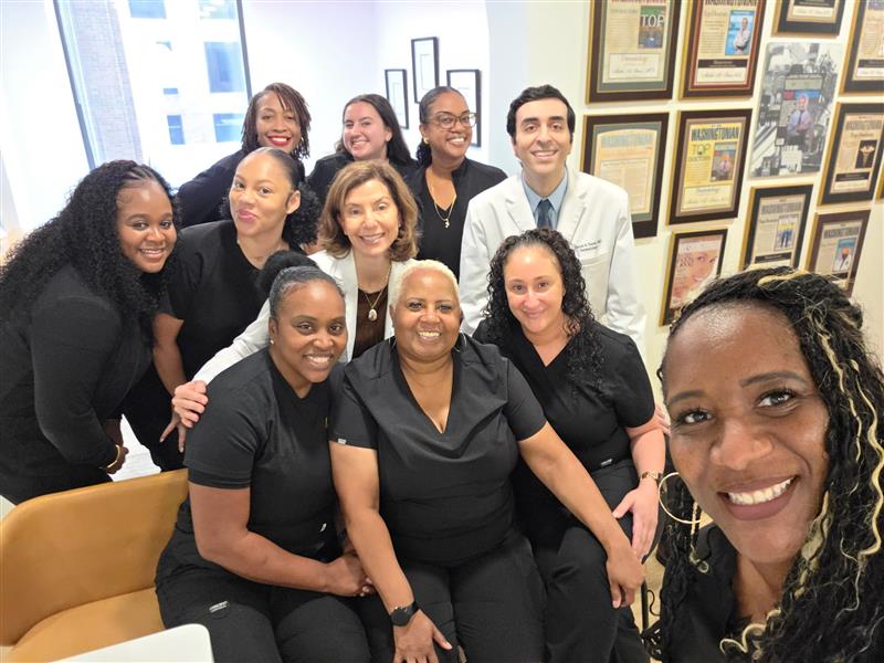 Instagram post by Dr. Melda A. Isaac: Annual office selfie tradition! Grateful for this incredible team and the work we do together. 💙📸 From healthy skin to happy smiles — we’r…