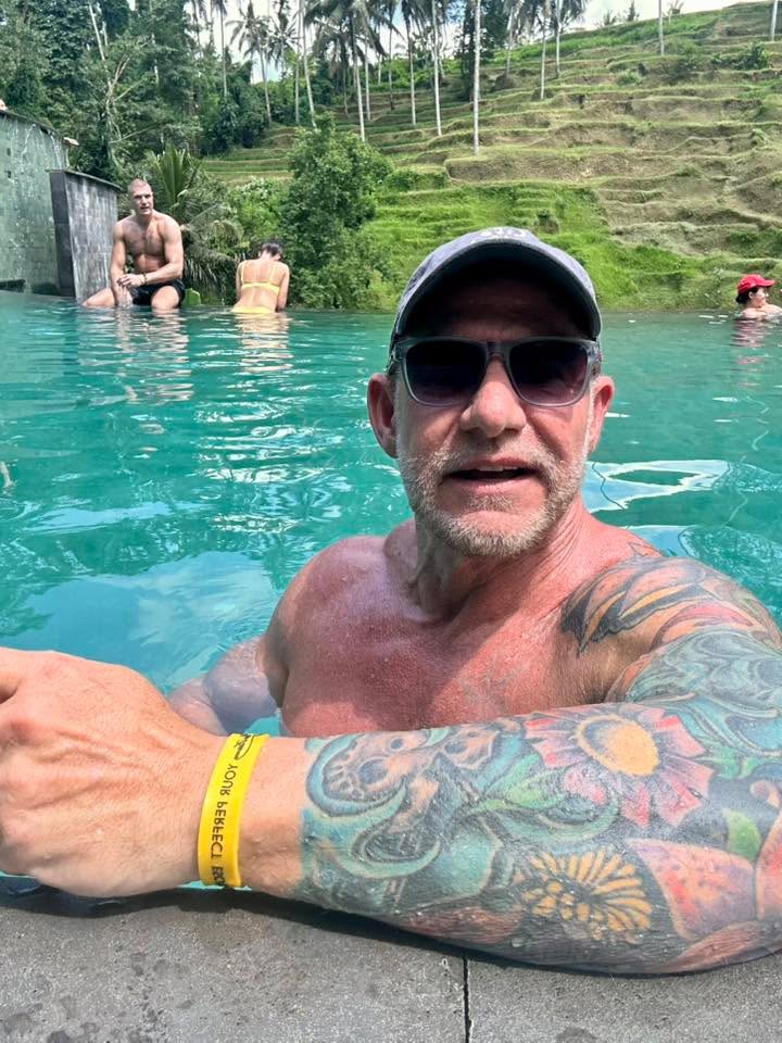 Instagram post by Dr. Paul Talbot: What a great day relaxing at the beach club. Drinks, food, sun and my man, all add up to a great day