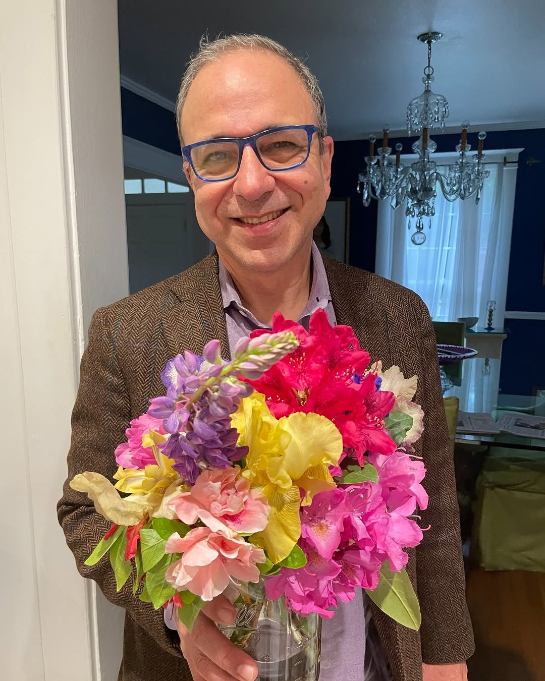 Instagram post by Dr. Ricardo L. Rodriguez: We love our patients. They are so generous to pick the carefully tended flowers from their own garden and share them with us. This bouquet c…