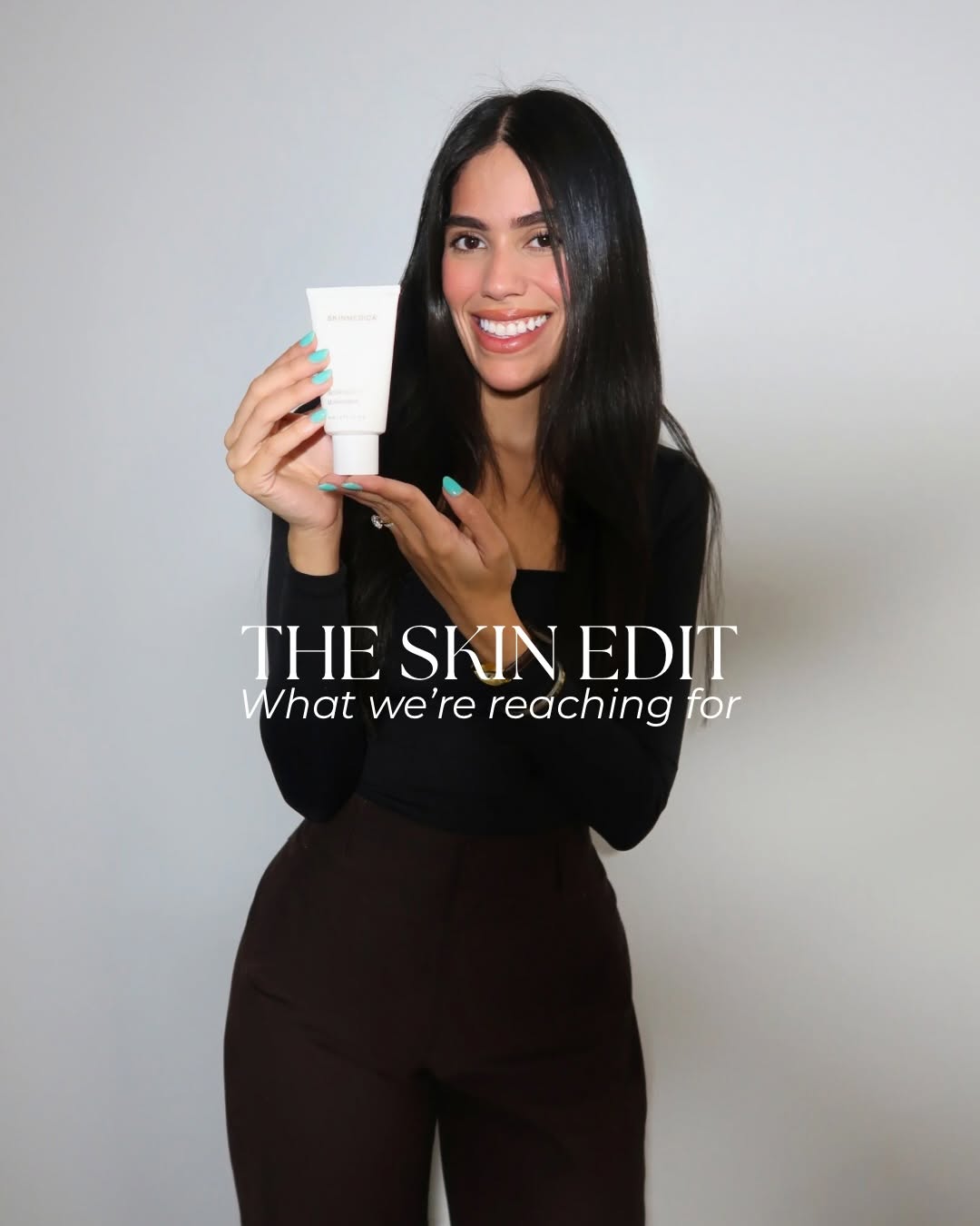 Staff member holding SkinMedica Rejuvenative Moisturizer for The Skin Edit, featuring skincare products now available at our practice.