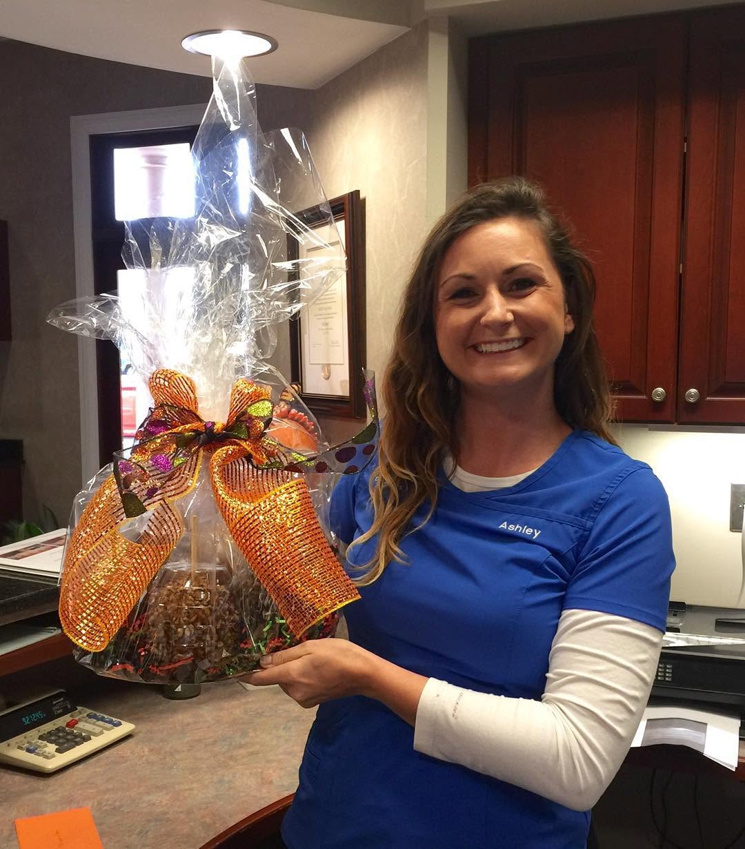 Instagram post by Dr. Ricky Lane, DDS: Thanks to Savannah Perio & Implants for the beautiful Candy Apple Arrangement! #StatesboroDentist #SavannahPerio&Implants #DentalLove