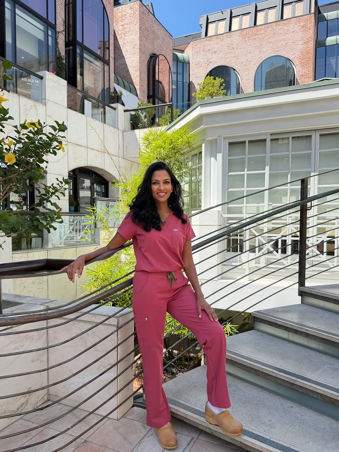 Instagram post by Dr. Sarmela Sunder: The newest color from @wearfigs , and I'm officially obsessed! Berry Spice, the perfect pop of color. 🍓 #figs #figsambassador #plasticsurge…