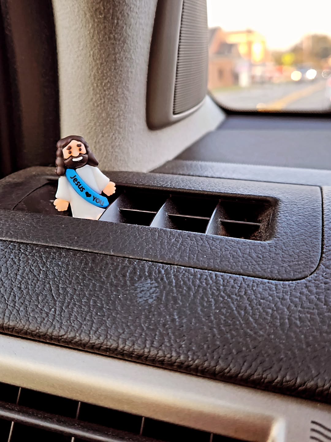 Instagram post by Dr. Tanda Lane: I have a burgeoning driver. She's inheriting my 10 year old car. She's putting her imprint on it daily. Stickers, magnets, etc. This was one…